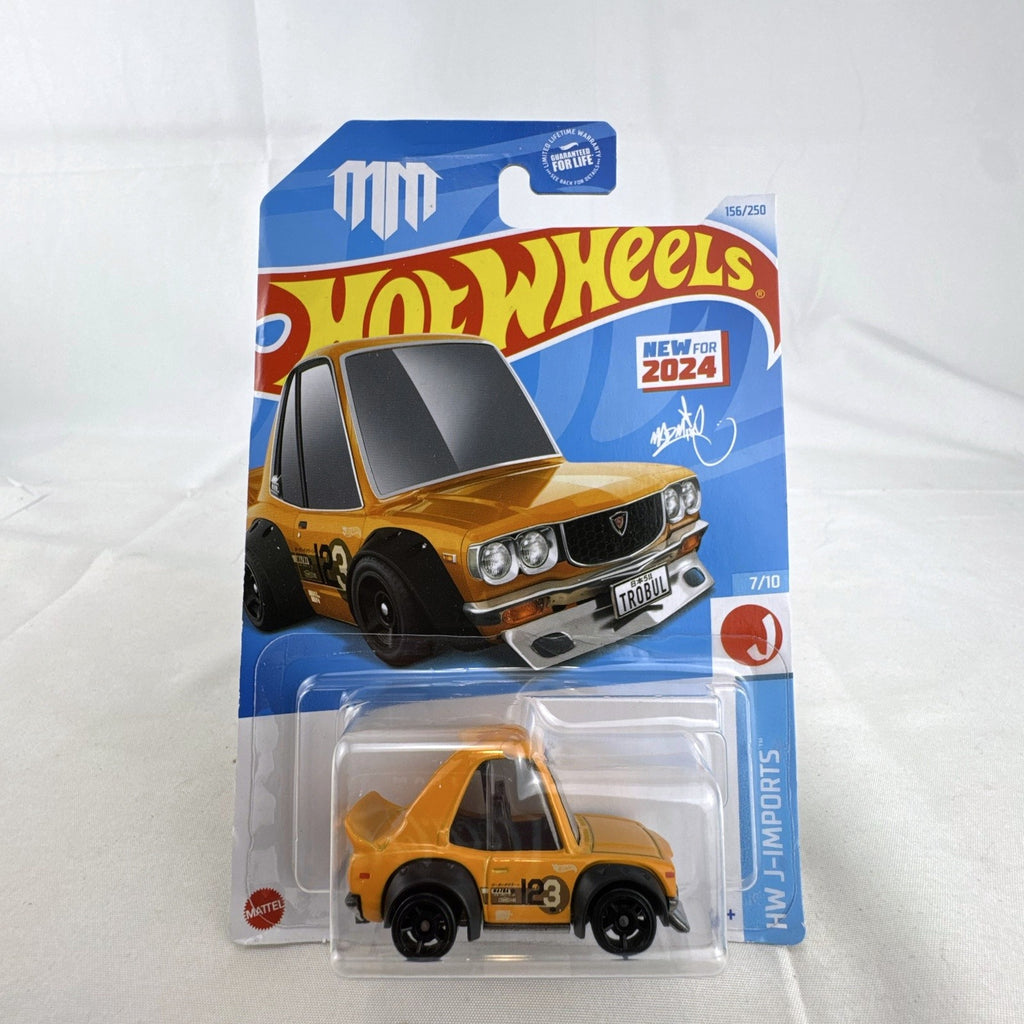 Hot Wheels 1:64 scale Tooned Mazda RX-3 diecast car in bright orange, factory sealed on original card.