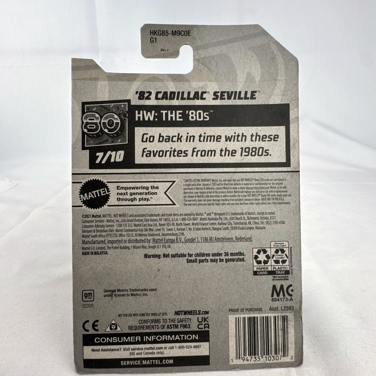 Hot Wheels 1:64 scale 1982 Cadillac Seville diecast car in gold two-tone finish, factory sealed on original card.