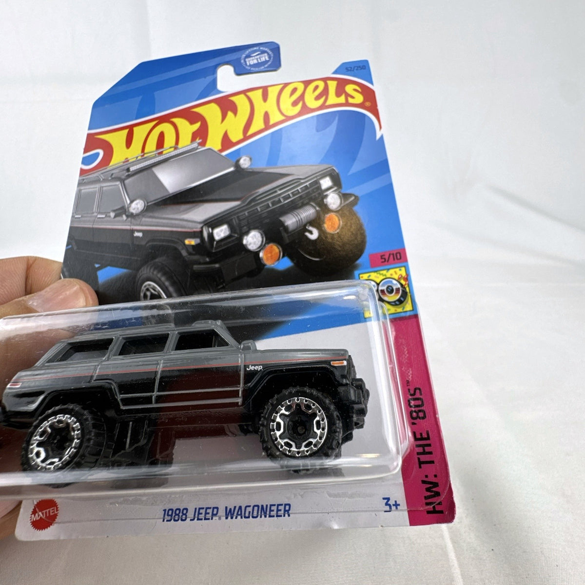 Unopened Hot Wheels 1988 Jeep Wagoneer 1:64 scale dark gray diecast SUV in original HW The 80s series blister card.