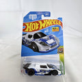 Hot Wheels 1:64 scale Mad Mike Drift Attack diecast car in white with race graphics, factory sealed on original card