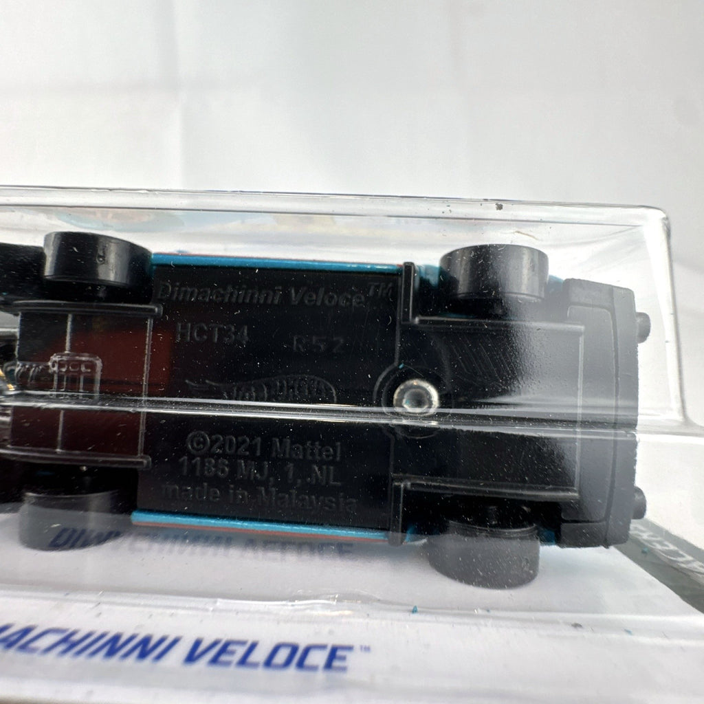 Hot Wheels Dimachinni Veloce 1:64 scale diecast rally car in metallic blue unopened on cardback