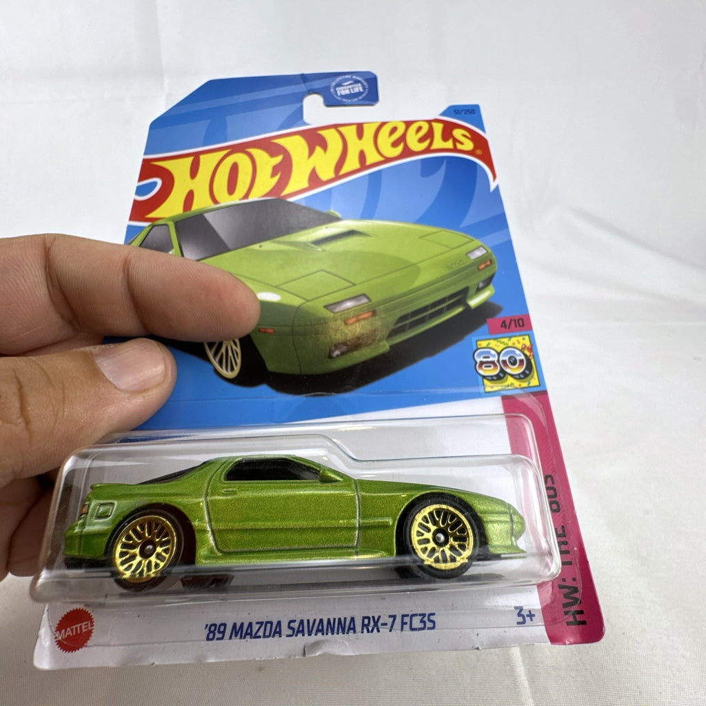 Hot Wheels '89 Mazda Savanna RX-7 FC3S 1:64 diecast car in metallic green on unopened card