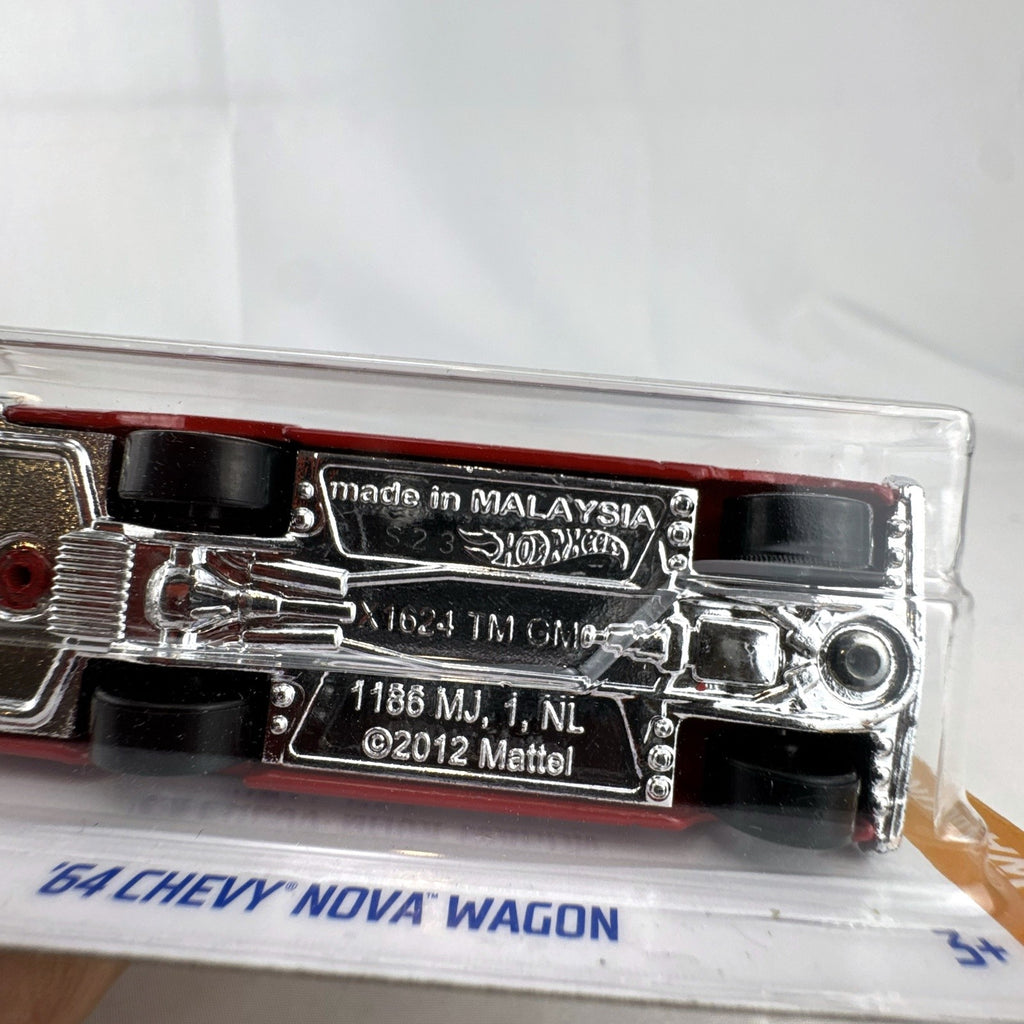 Hot Wheels 1964 Chevy Nova Wagon 1:64 scale diecast car in deep red with white roof sealed on blister card.