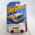 Hot Wheels 1:64 scale 1984 Audi Sport Quattro diecast rally car in white with original card packaging.