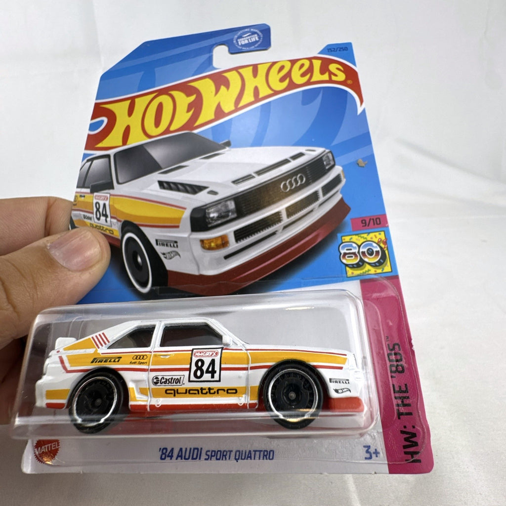 Hot Wheels 1:64 scale 1984 Audi Sport Quattro diecast rally car in white with original card packaging.