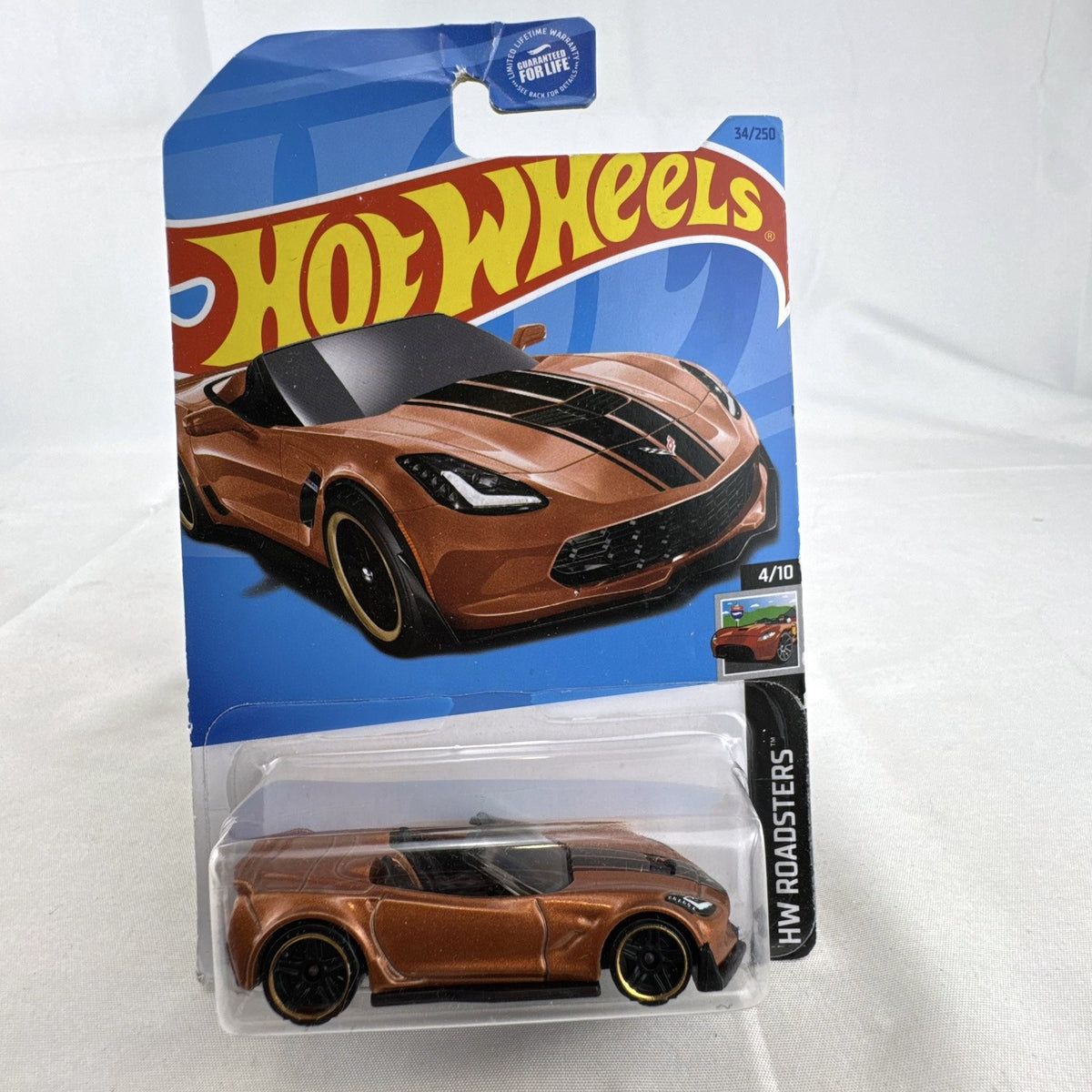 Hot Wheels 1:64 scale Chevrolet Corvette C7 Z06 Convertible diecast car in metallic copper brown sealed on card