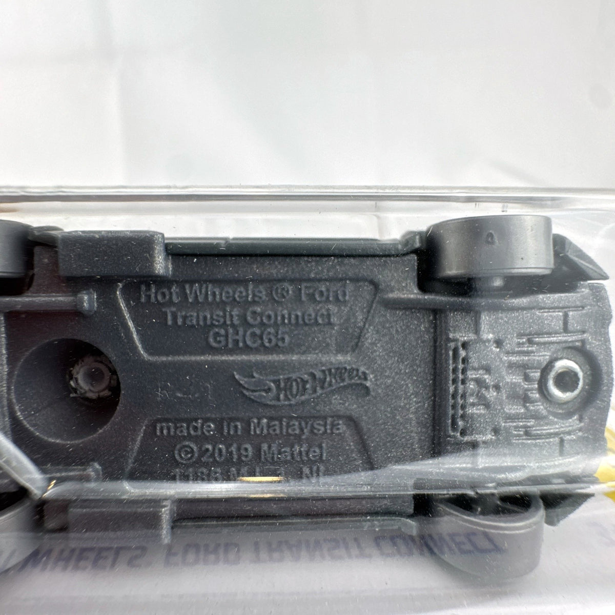 Hot Wheels 1:64 scale Ford Transit Connect diecast van from the HW Art Cars series in original packaging.