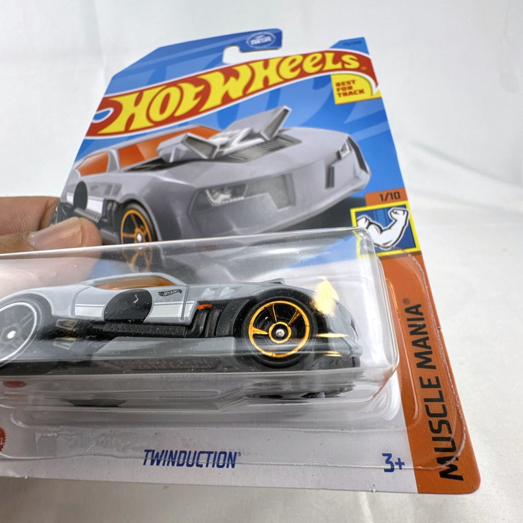 Hot Wheels Twinduction 1:64 scale diecast muscle car in gray on original sealed card packaging.