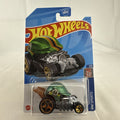 Sealed 2022 Hot Wheels Head Gasket 1:64 scale diecast car in metallic green baseball helmet style on original card.