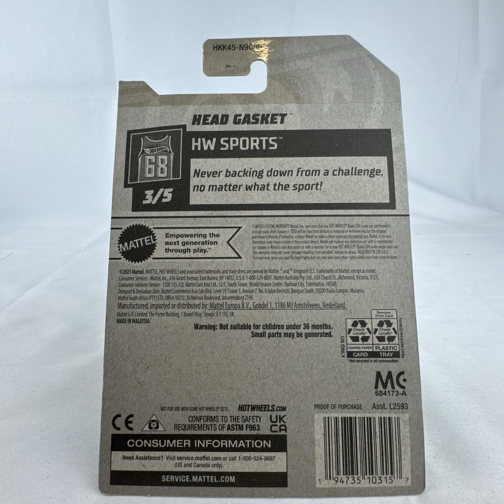 Sealed 2022 Hot Wheels Head Gasket 1:64 scale diecast car in metallic green baseball helmet style on original card.