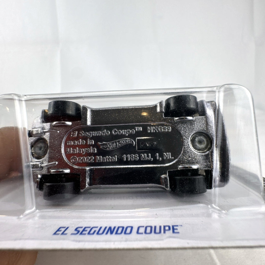 Hot Wheels 1:64 scale El Segundo Coupe diecast car in silver, sealed on original HW Dream Garage card.