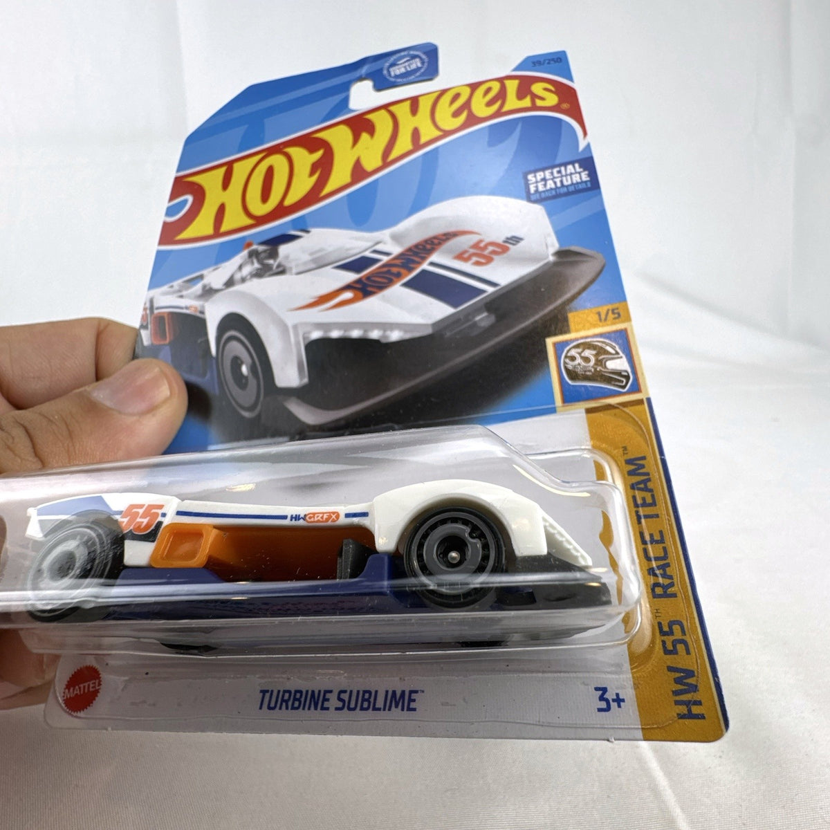 Hot Wheels 1:64 scale Turbine Sublime diecast car in white 55th Anniversary Race Team livery packaged on card.