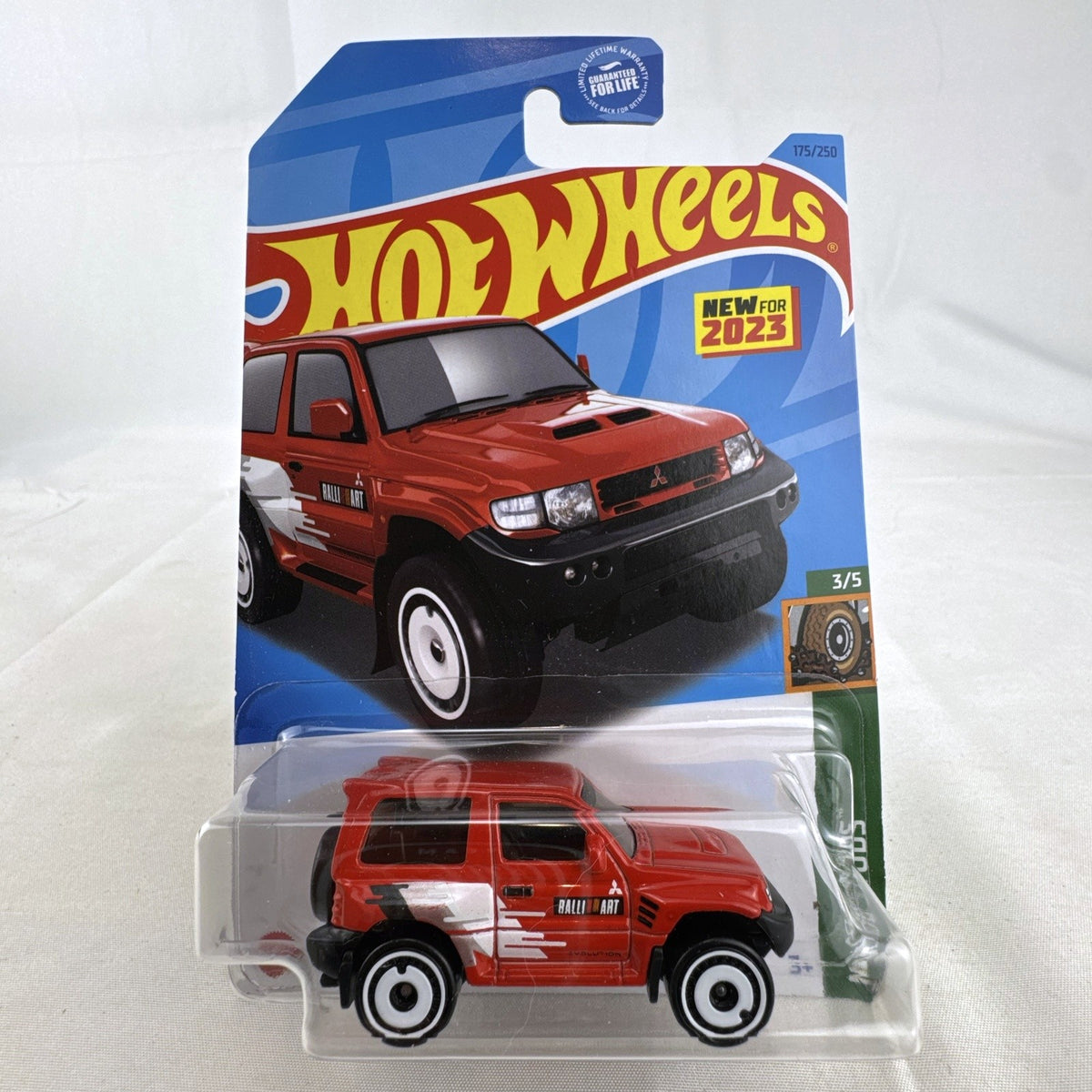Hot Wheels 1:64 scale red Mitsubishi Pajero Evolution Ralliart diecast SUV in original packaging