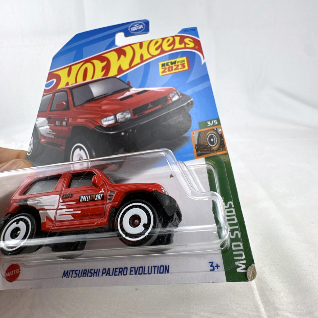 Hot Wheels 1:64 scale red Mitsubishi Pajero Evolution Ralliart diecast SUV in original packaging