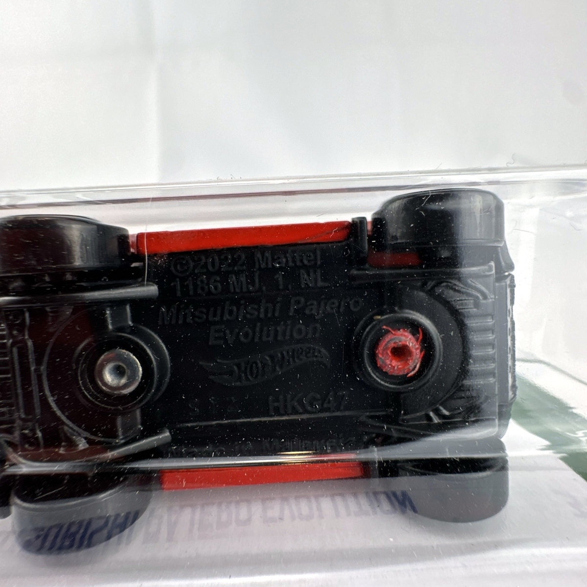 Hot Wheels 1:64 scale red Mitsubishi Pajero Evolution Ralliart diecast SUV in original packaging