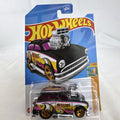 Hot Wheels Surf 'N Turf 1:64 scale diecast hot rod wagon in black with Malibu California tampo graphics in unopened pack