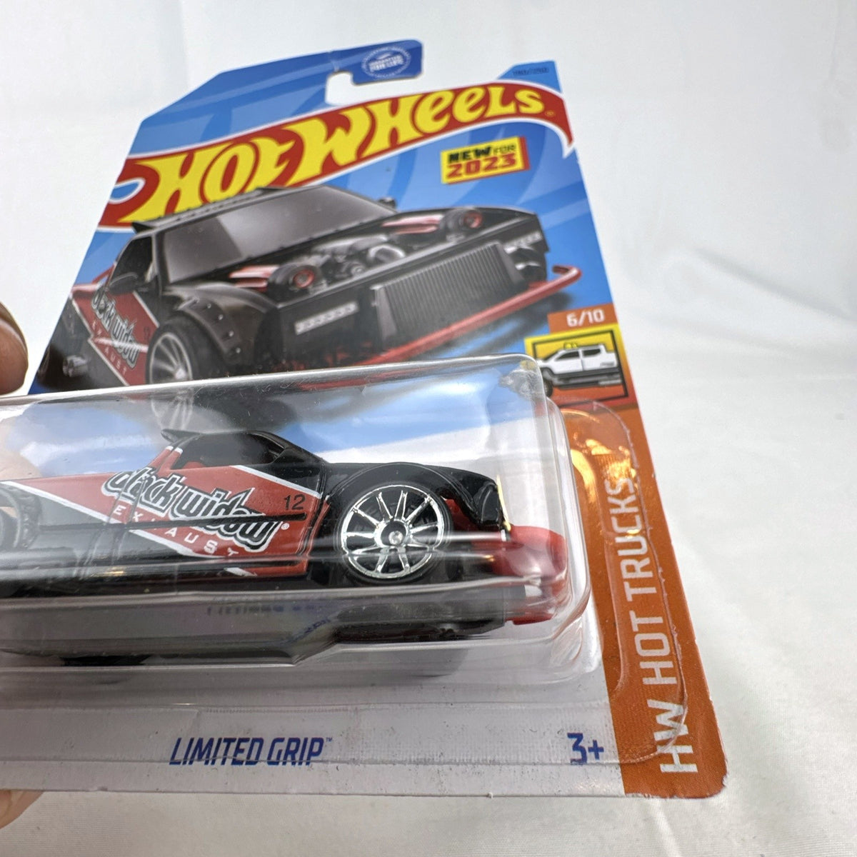 Hot Wheels 1:64 scale Limited Grip drift pickup truck in black with red Black Widow Exhaust livery factory sealed on card