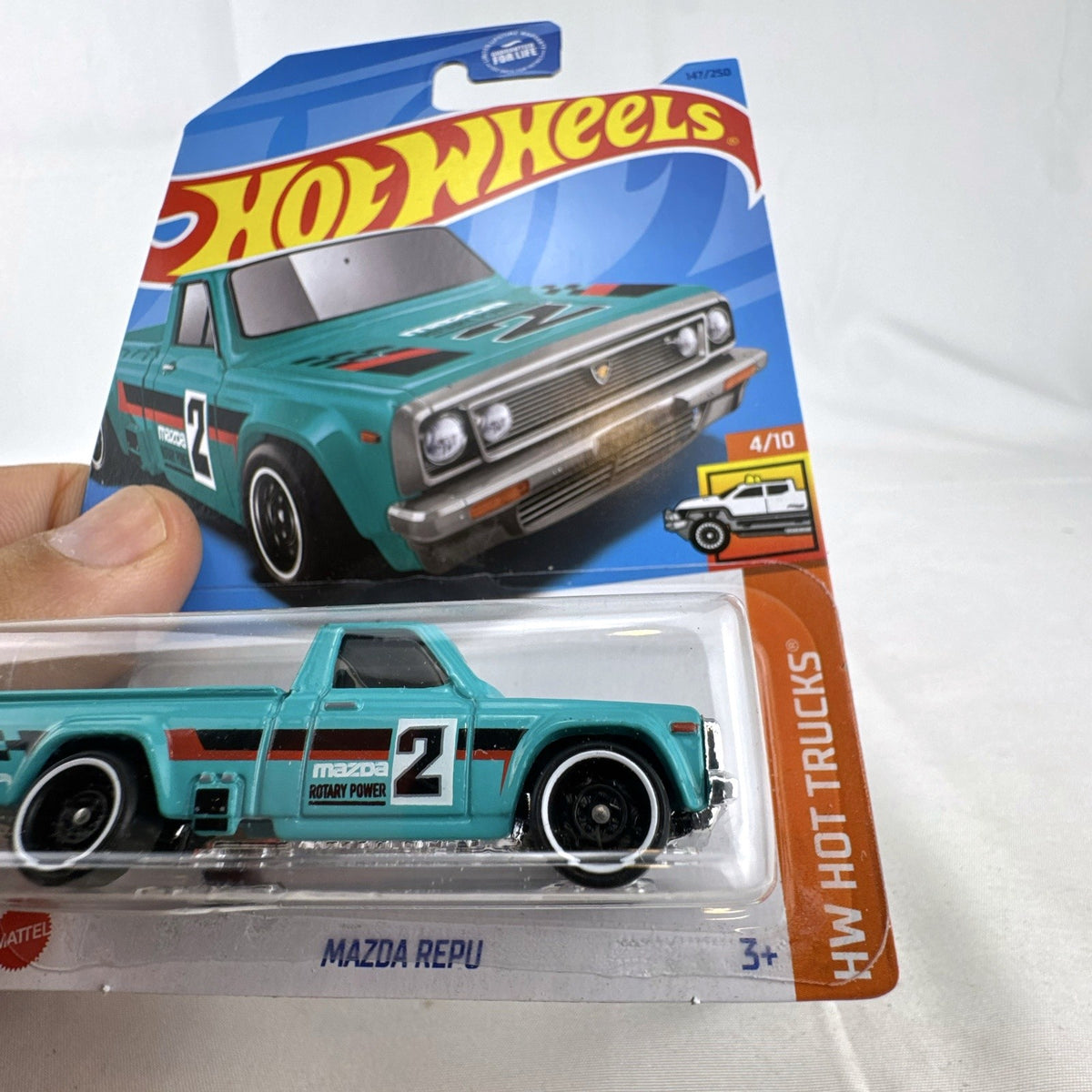 Hot Wheels 1:64 scale Mazda REPU pickup truck in teal, factory sealed on card
