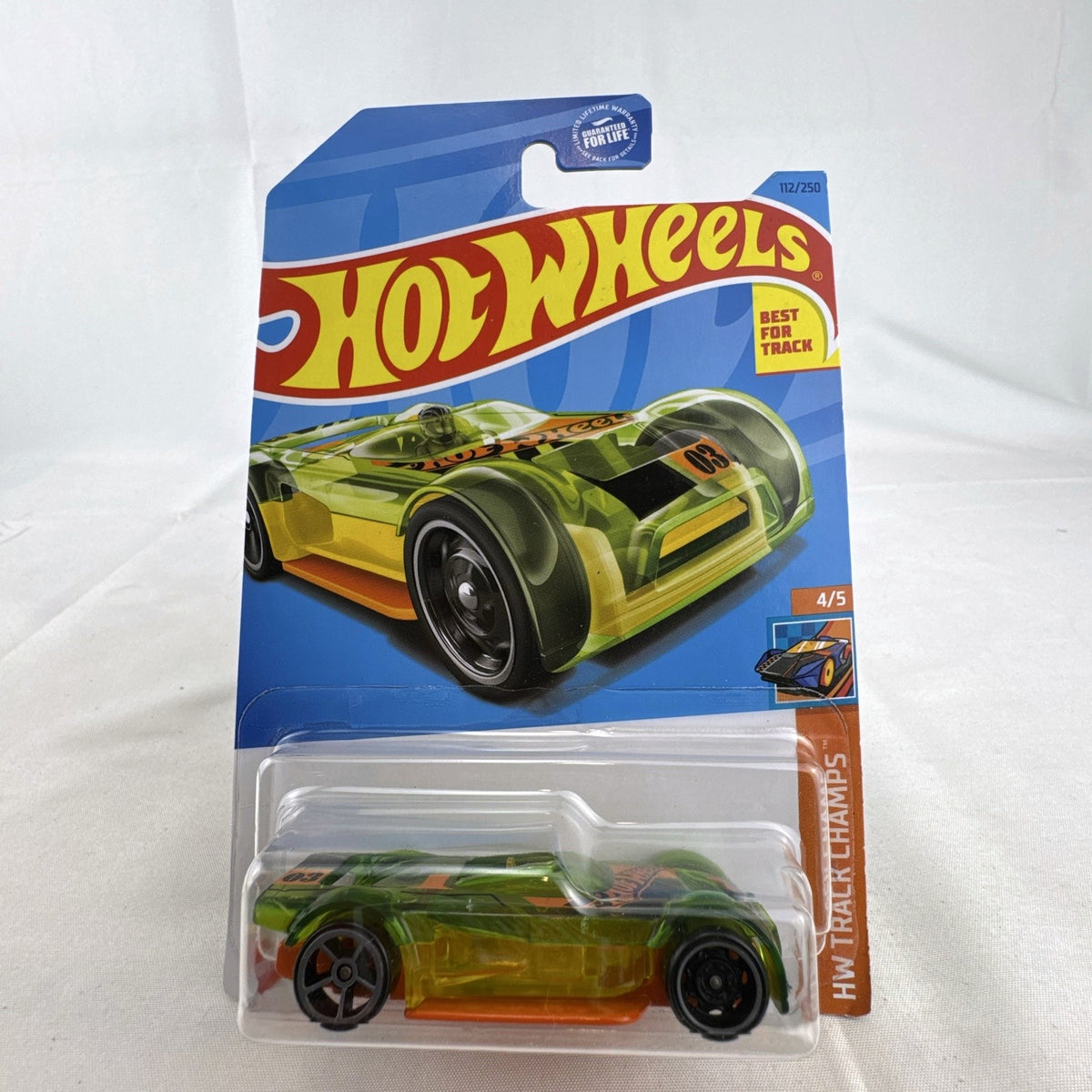Hot Wheels Mach It Go 1:64 scale diecast car in translucent green sealed on original HW Track Champs blister card.