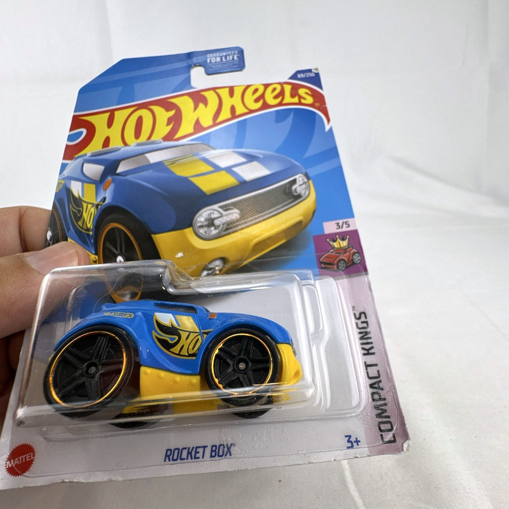 Factory sealed Hot Wheels Rocket Box 1:64 scale blue and yellow diecast car on blister card