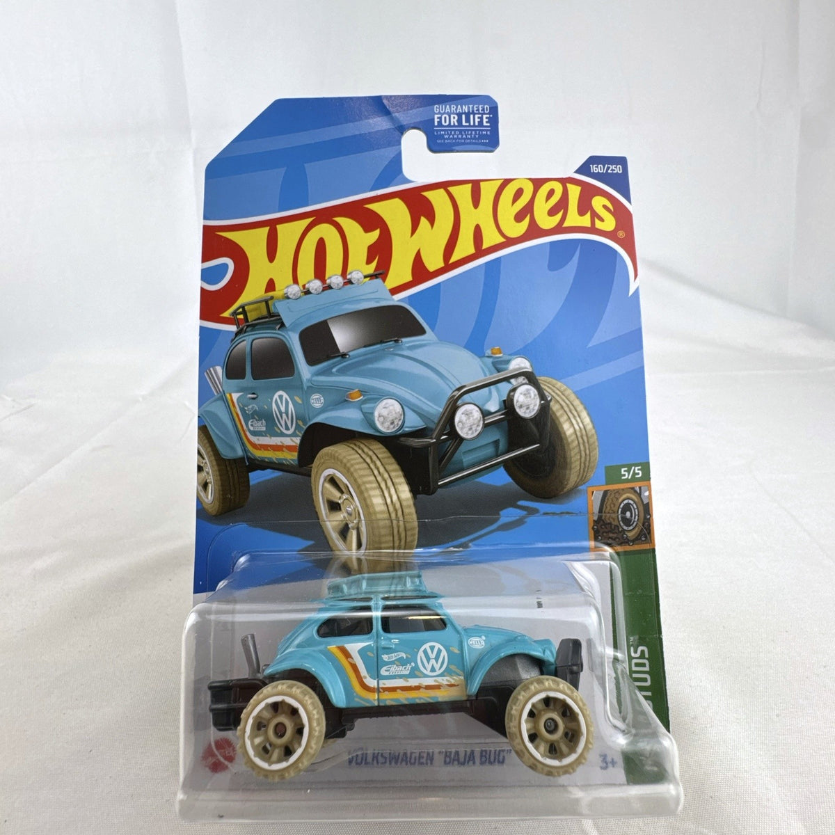 Hot Wheels 1:64 scale Volkswagen Baja Bug diecast car in light blue from the Mud Studs series sealed on card