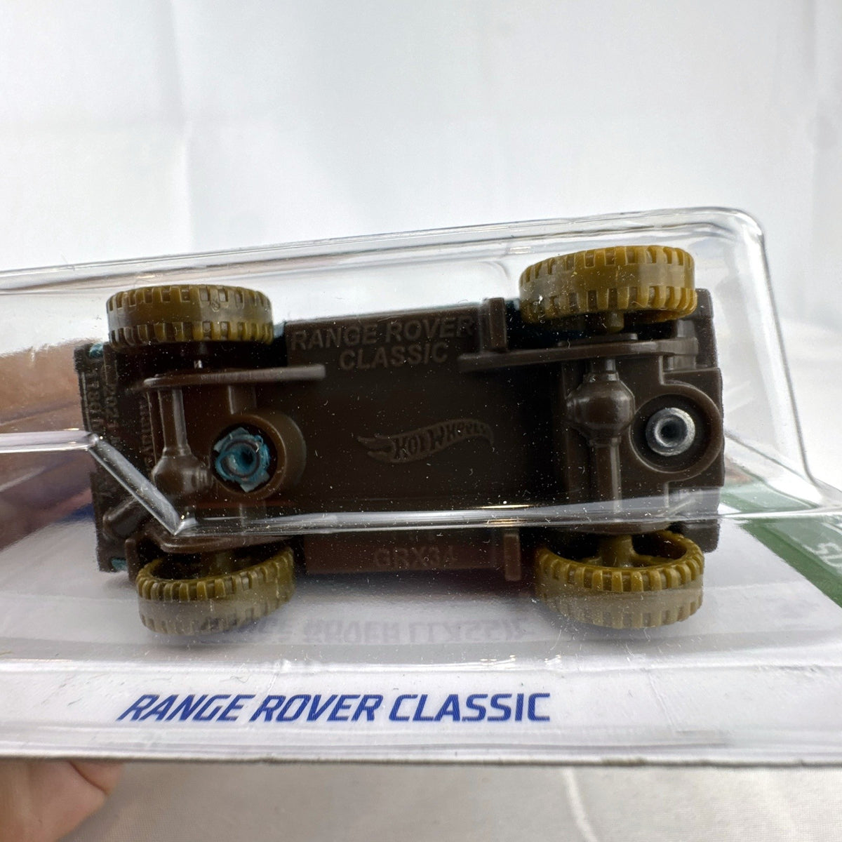 Hot Wheels 1:64 scale Land Rover Range Rover Classic Mud Studs diecast vehicle in teal sealed on original blister card