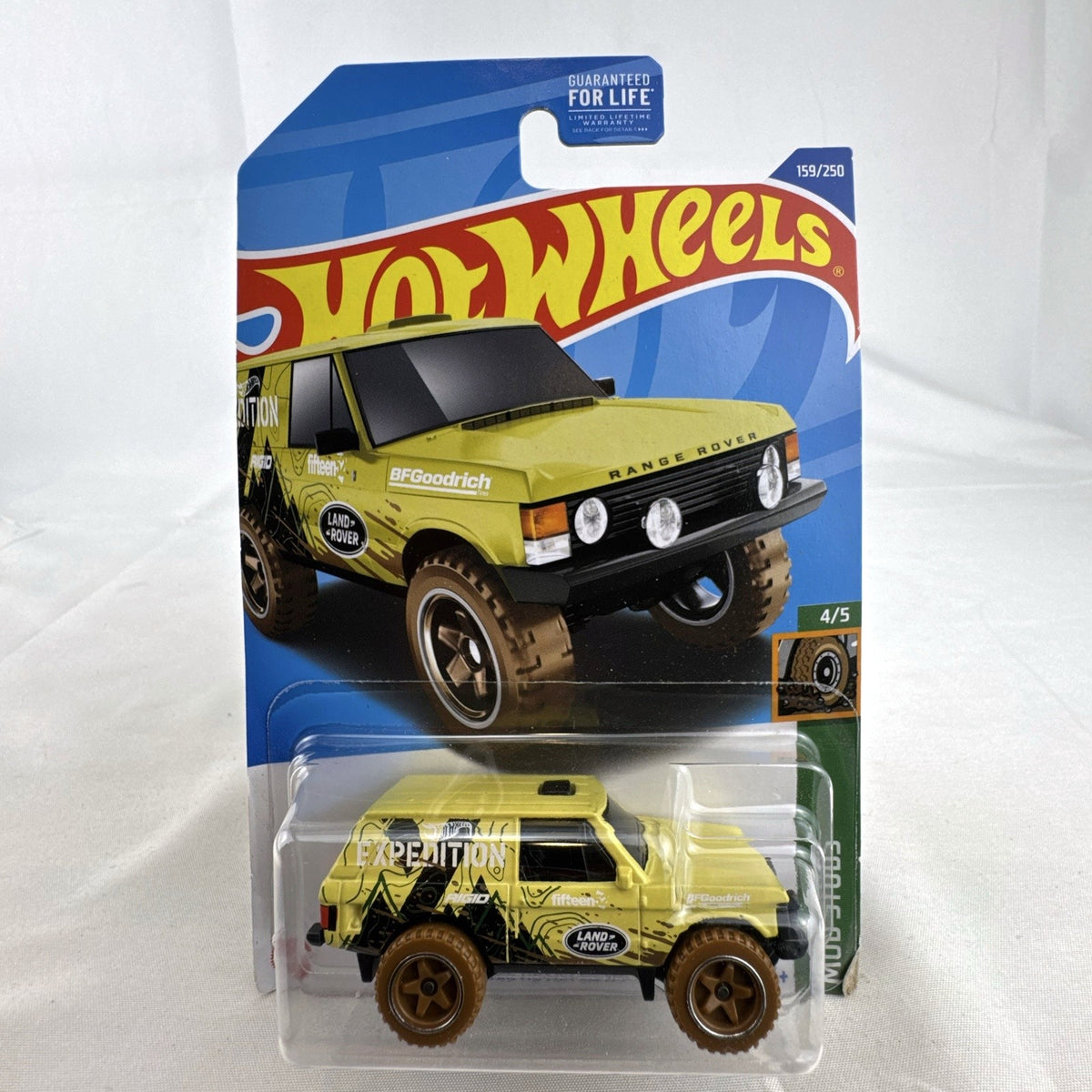 Hot Wheels 1:64 scale Land Rover Range Rover Classic Mud Studs diecast SUV in yellow blister package