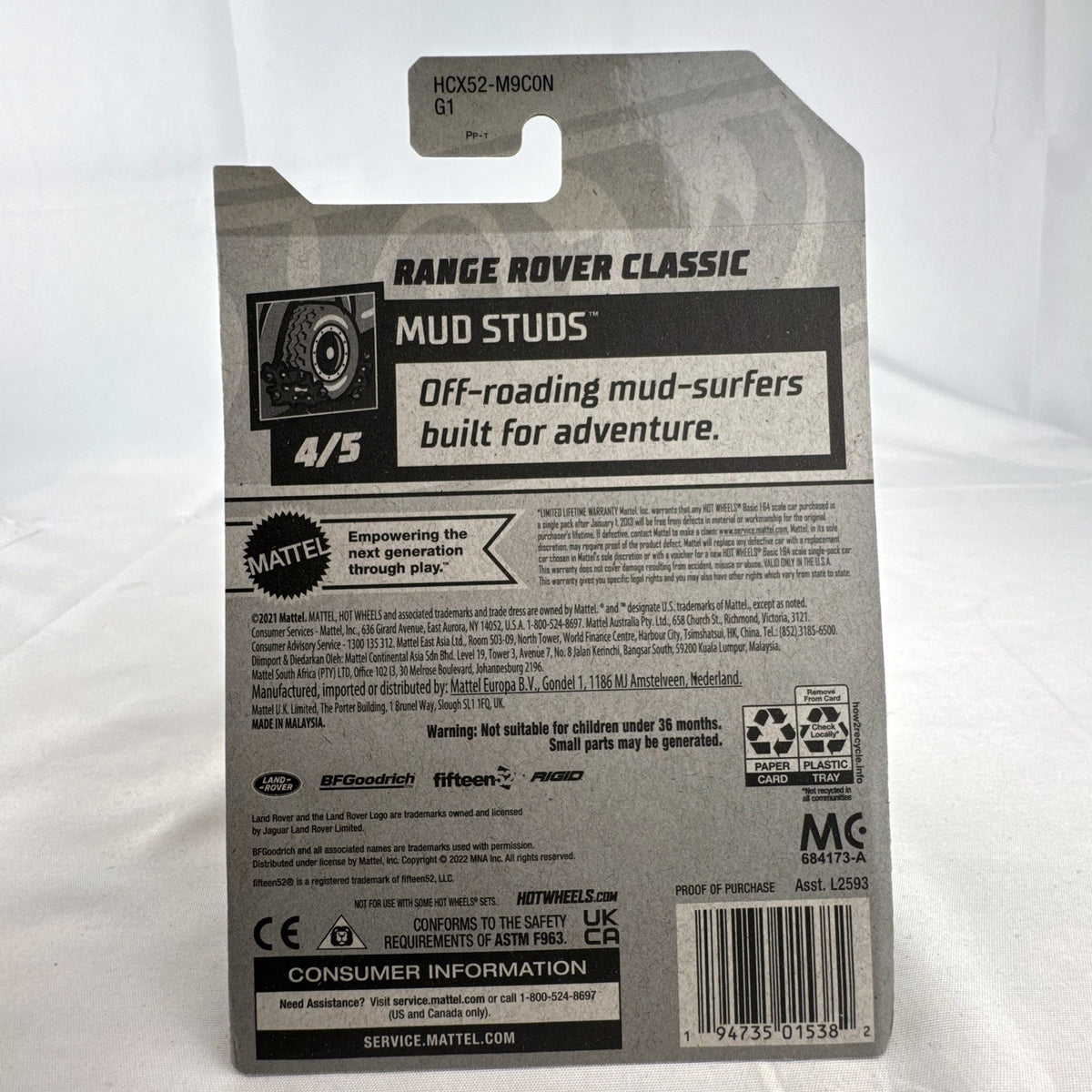 Hot Wheels 1:64 scale Land Rover Range Rover Classic Mud Studs diecast SUV in yellow blister package