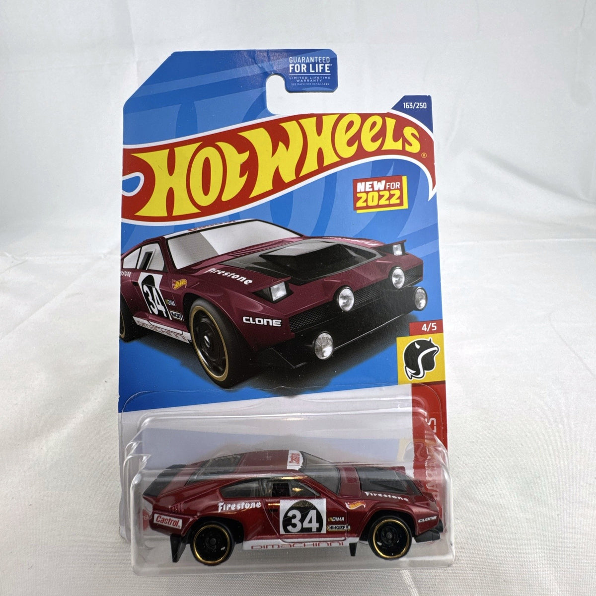 Hot Wheels 1:64 scale Dimachinni Veloce red diecast rally car sealed on 2022 HW Daredevils blister card.