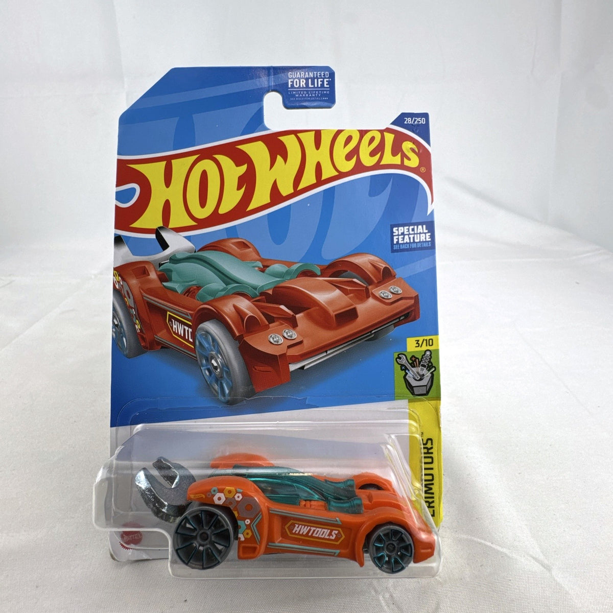 Hot Wheels 2022 Tooligan Experimotors 1:64 scale diecast car in orange sealed on card