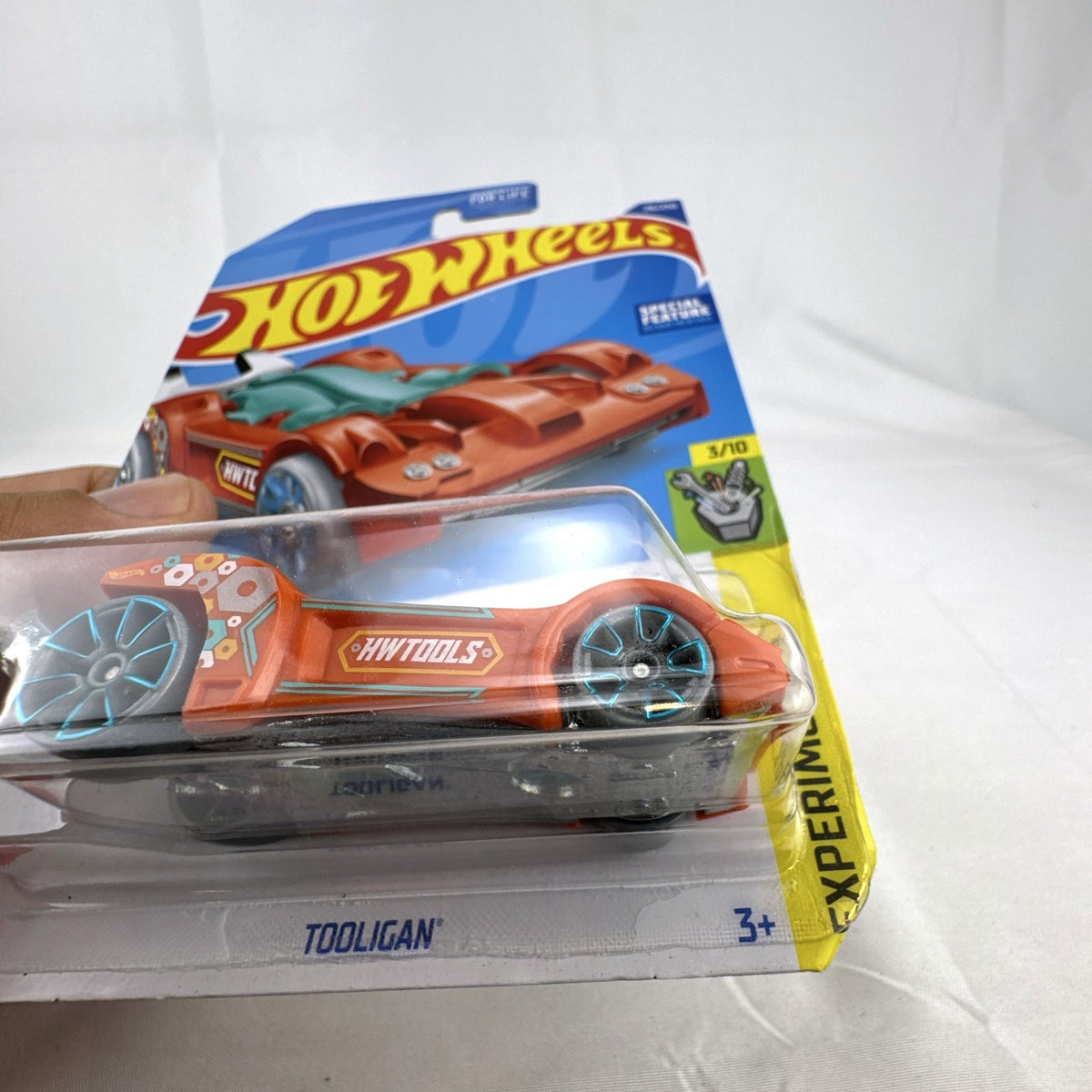 Hot Wheels 2022 Tooligan Experimotors 1:64 scale diecast car in orange sealed on card