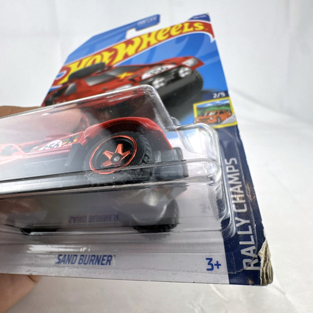 Hot Wheels 2022 Sand Burner 1:64 scale red diecast rally car in original blister card packaging.