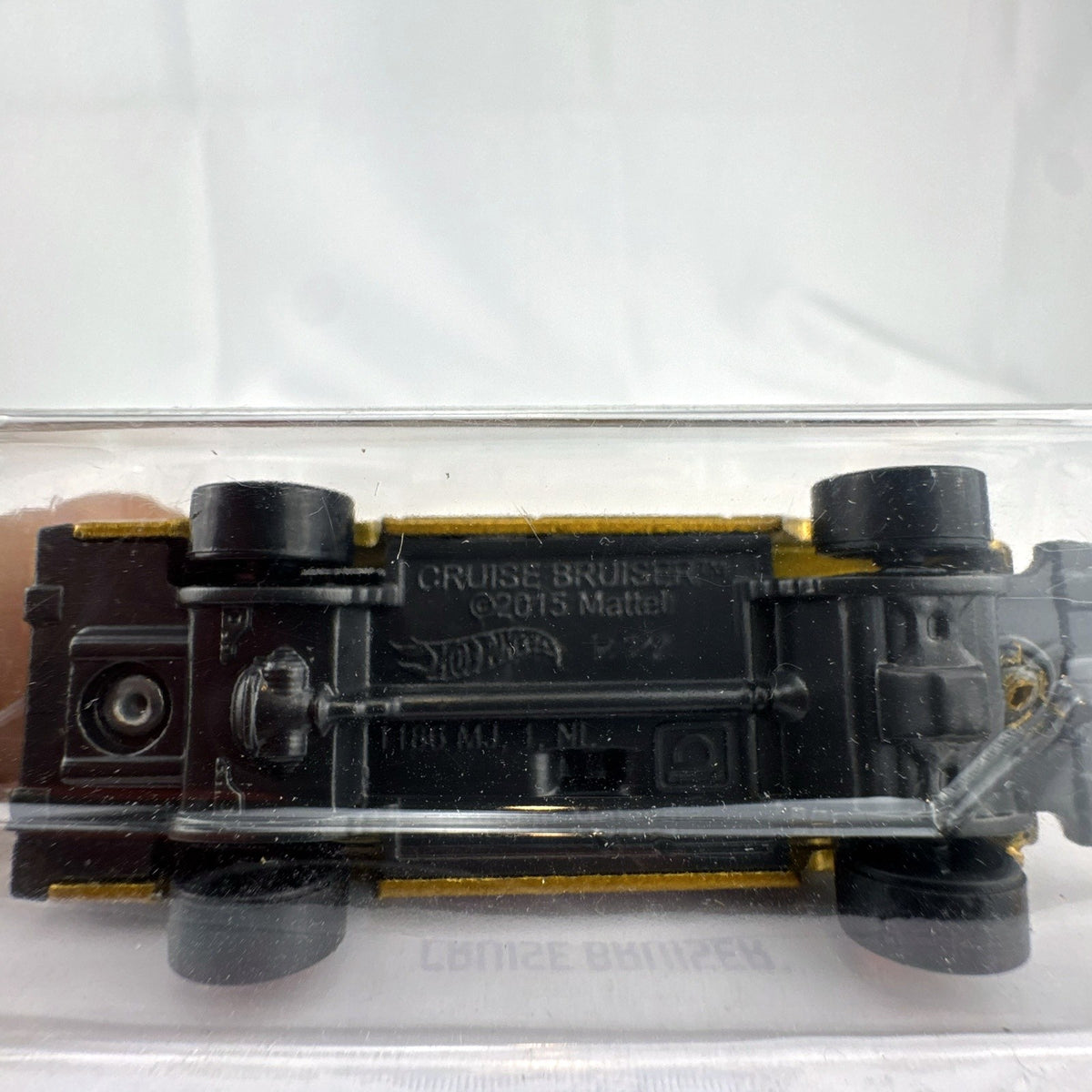 Hot Wheels Cruise Bruiser 1:64 scale diecast station wagon in metallic gold on original card.