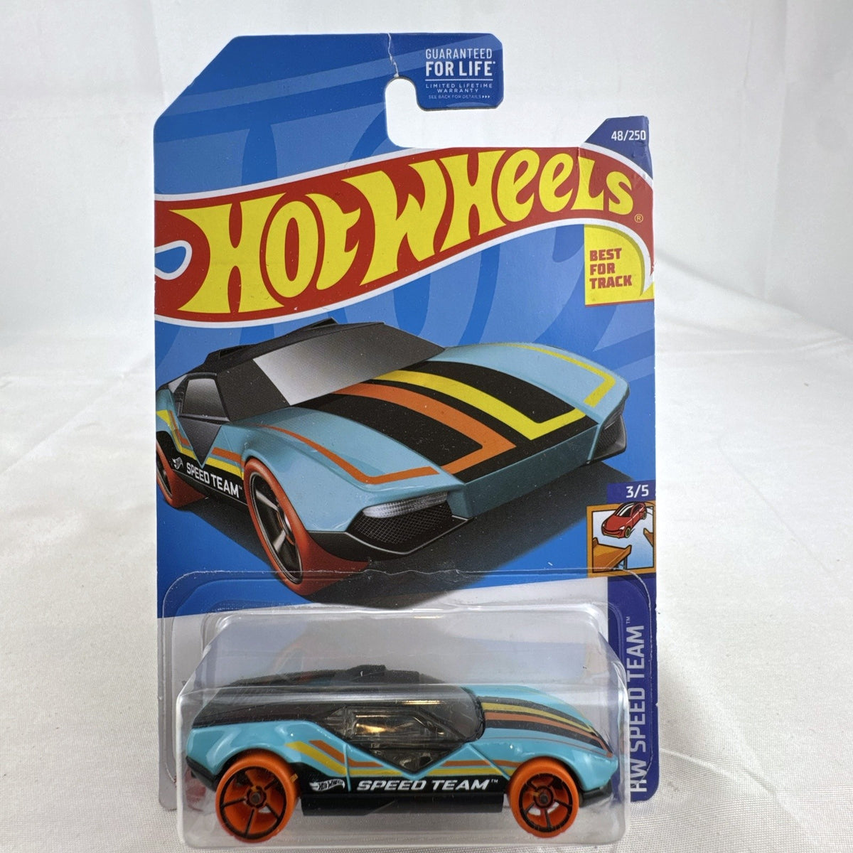 Hot Wheels La Fasta 1:64 scale light blue diecast car sealed on original HW Speed Team blister card.