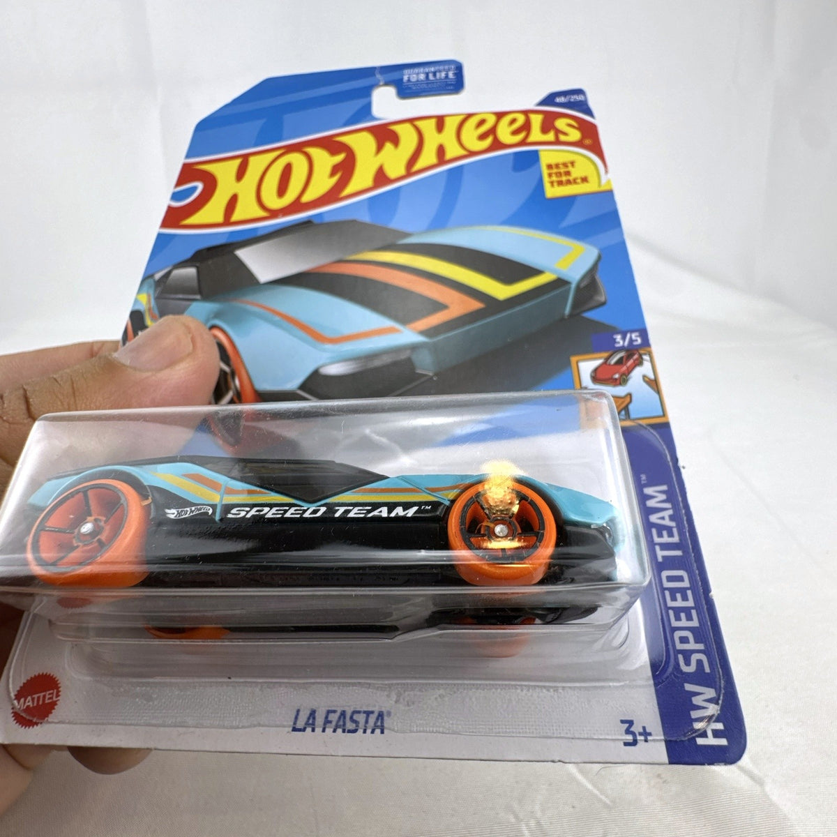 Hot Wheels La Fasta 1:64 scale light blue diecast car sealed on original HW Speed Team blister card.