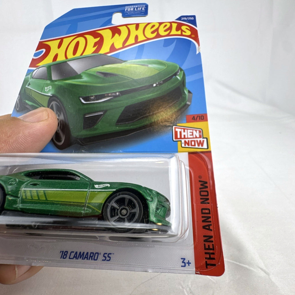 Hot Wheels 1:64 scale 2018 Chevrolet Camaro SS diecast car in metallic green, unopened on original blister card.