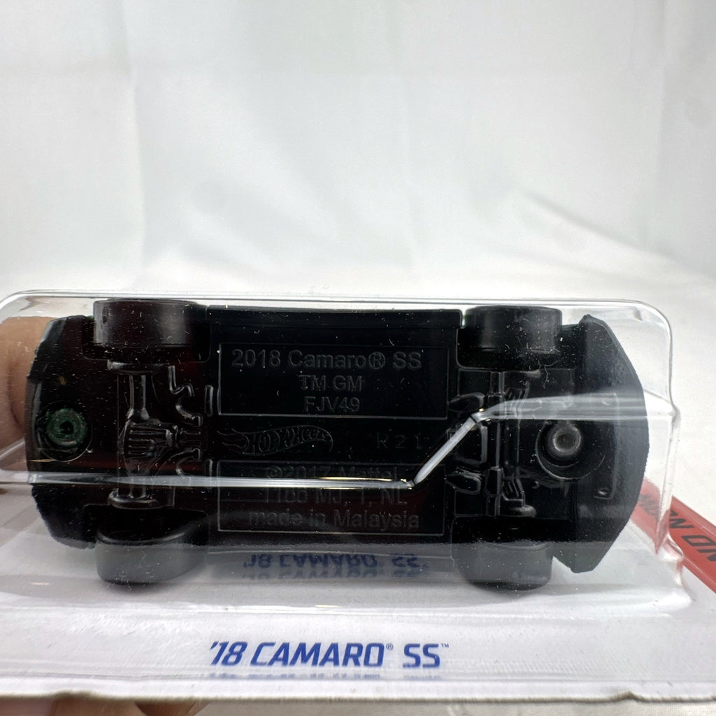 Hot Wheels 1:64 scale 2018 Chevrolet Camaro SS diecast car in metallic green, unopened on original blister card.