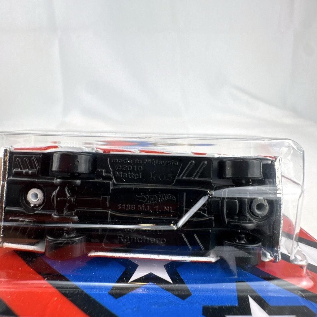 Hot Wheels 1965 Ford Ranchero 1:64 diecast in white with Stars & Stripes patriotic graphics, unopened on card.