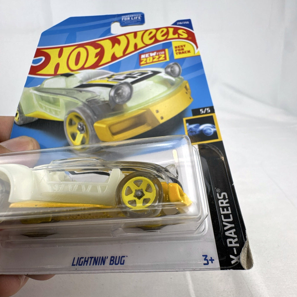 Sealed 2022 Hot Wheels Lightnin' Bug 1:64 scale diecast car in yellow X-Raycers translucent style on card