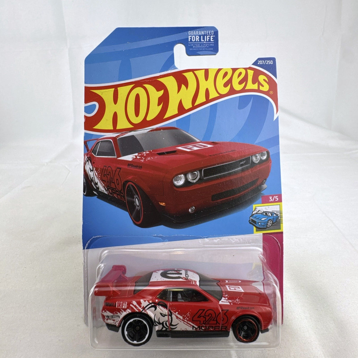 Hot Wheels 1:64 scale red Dodge Challenger Drift Car sealed on card with Mopar and Formula Drift graphics.