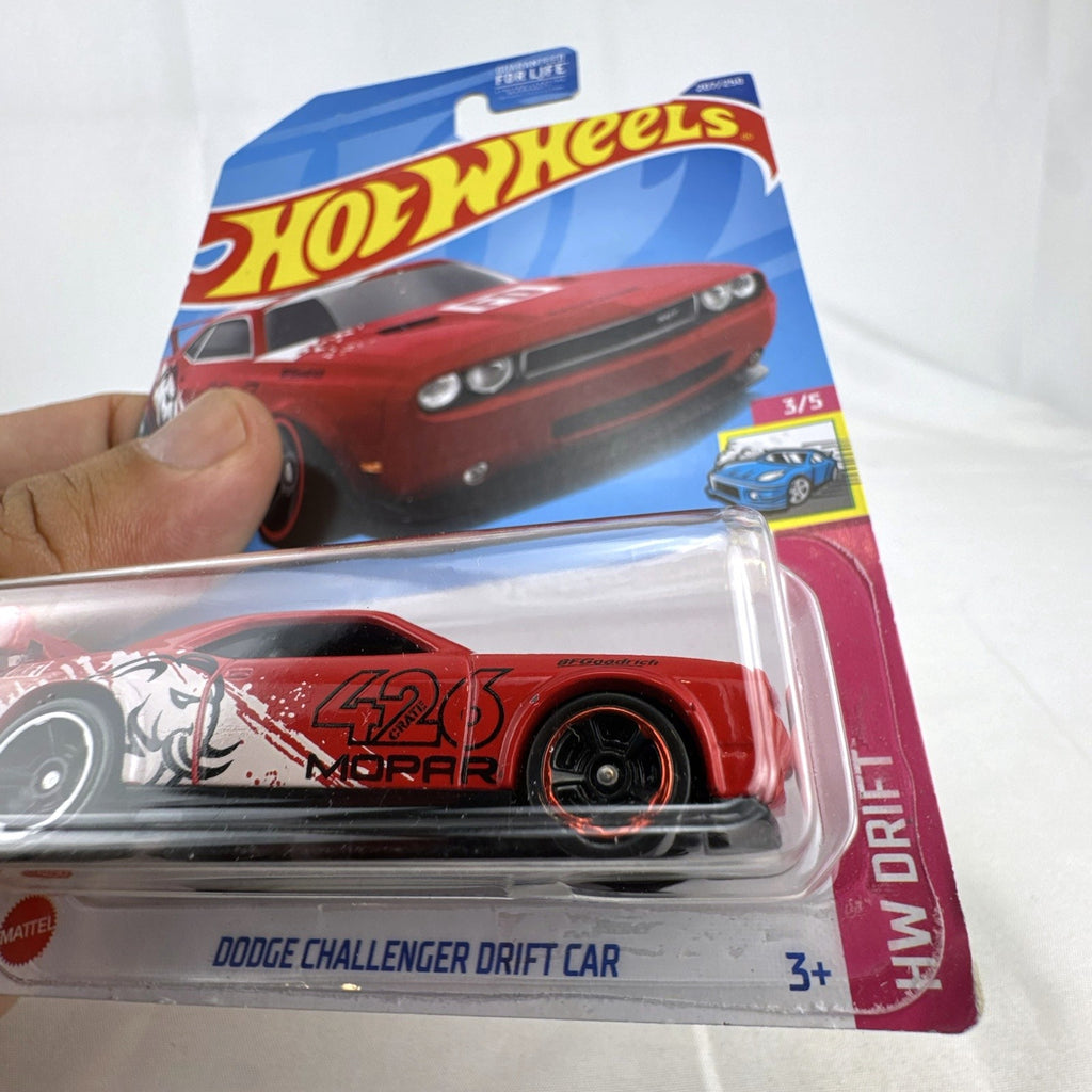 Hot Wheels 1:64 scale red Dodge Challenger Drift Car sealed on card with Mopar and Formula Drift graphics.