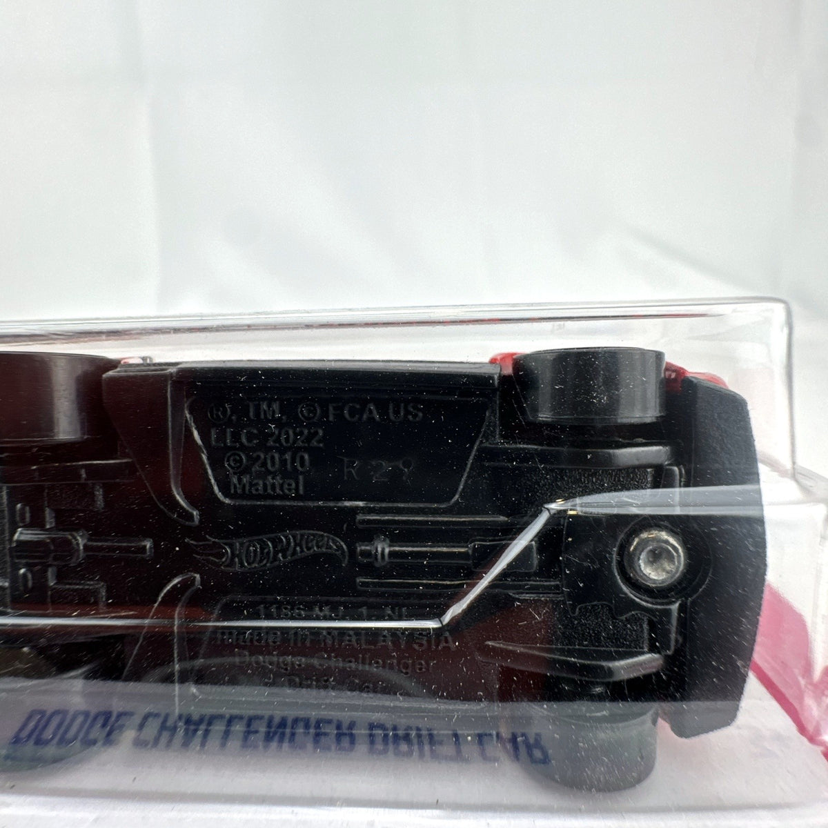 Hot Wheels 1:64 scale red Dodge Challenger Drift Car sealed on card with Mopar and Formula Drift graphics.