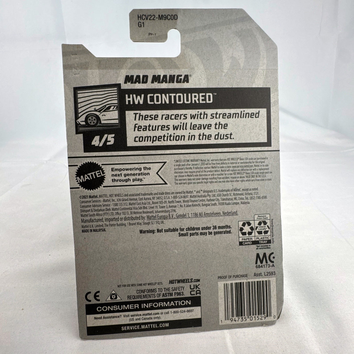 Hot Wheels Mad Manga 1:64 scale diecast car in dark blue, sealed on original HW Contoured blister card.