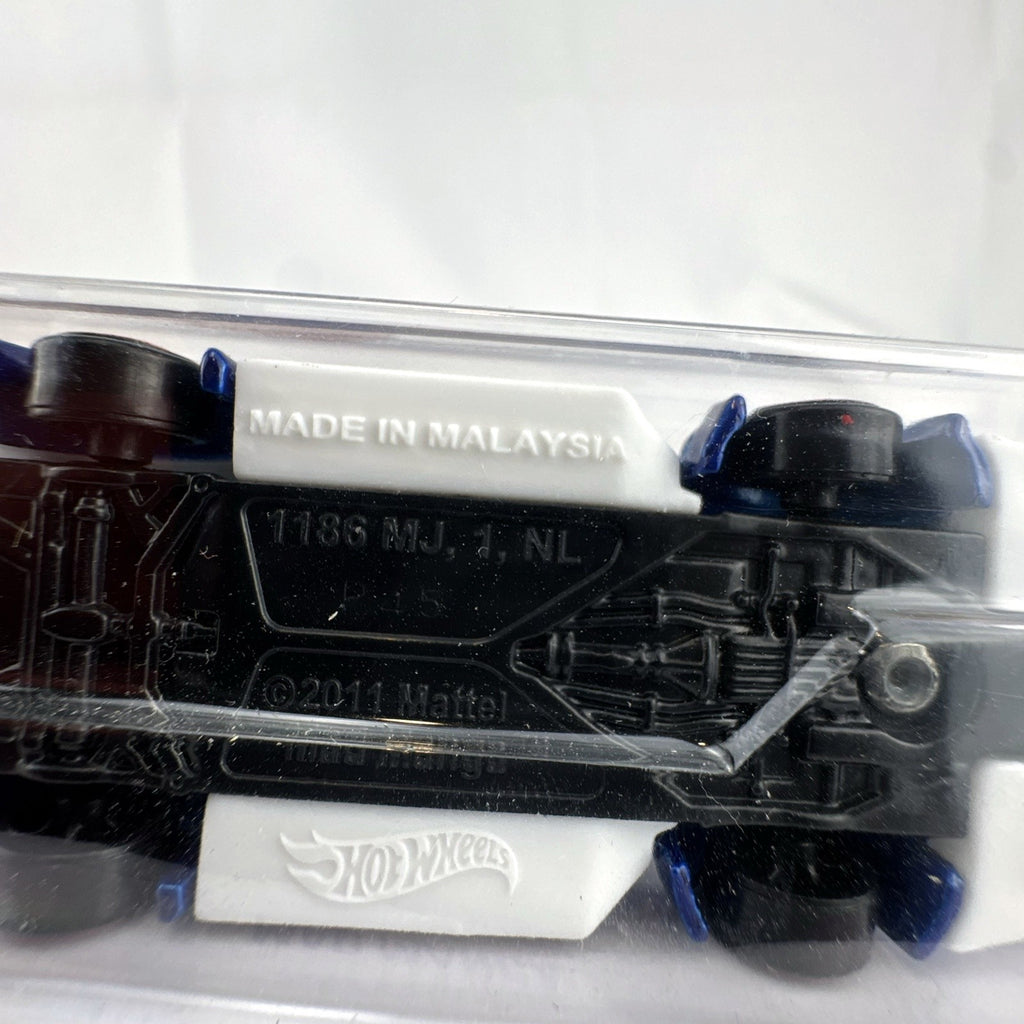 Hot Wheels Mad Manga 1:64 scale diecast car in dark blue, sealed on original HW Contoured blister card.