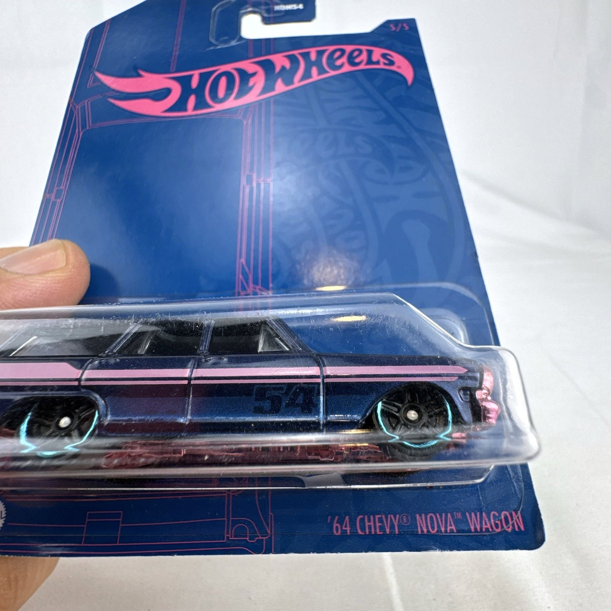 Hot Wheels 54th Anniversary 1:64 scale 1964 Chevy Nova Wagon diecast car in dark blue and pink original sealed packaging