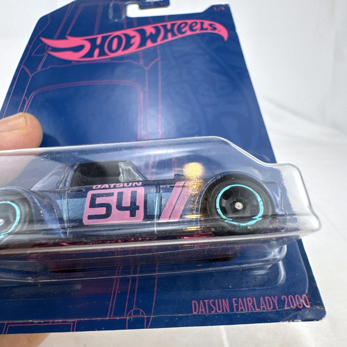 Hot Wheels 1:64 scale Datsun Fairlady 2000 54th Anniversary diecast car sealed on blister card.