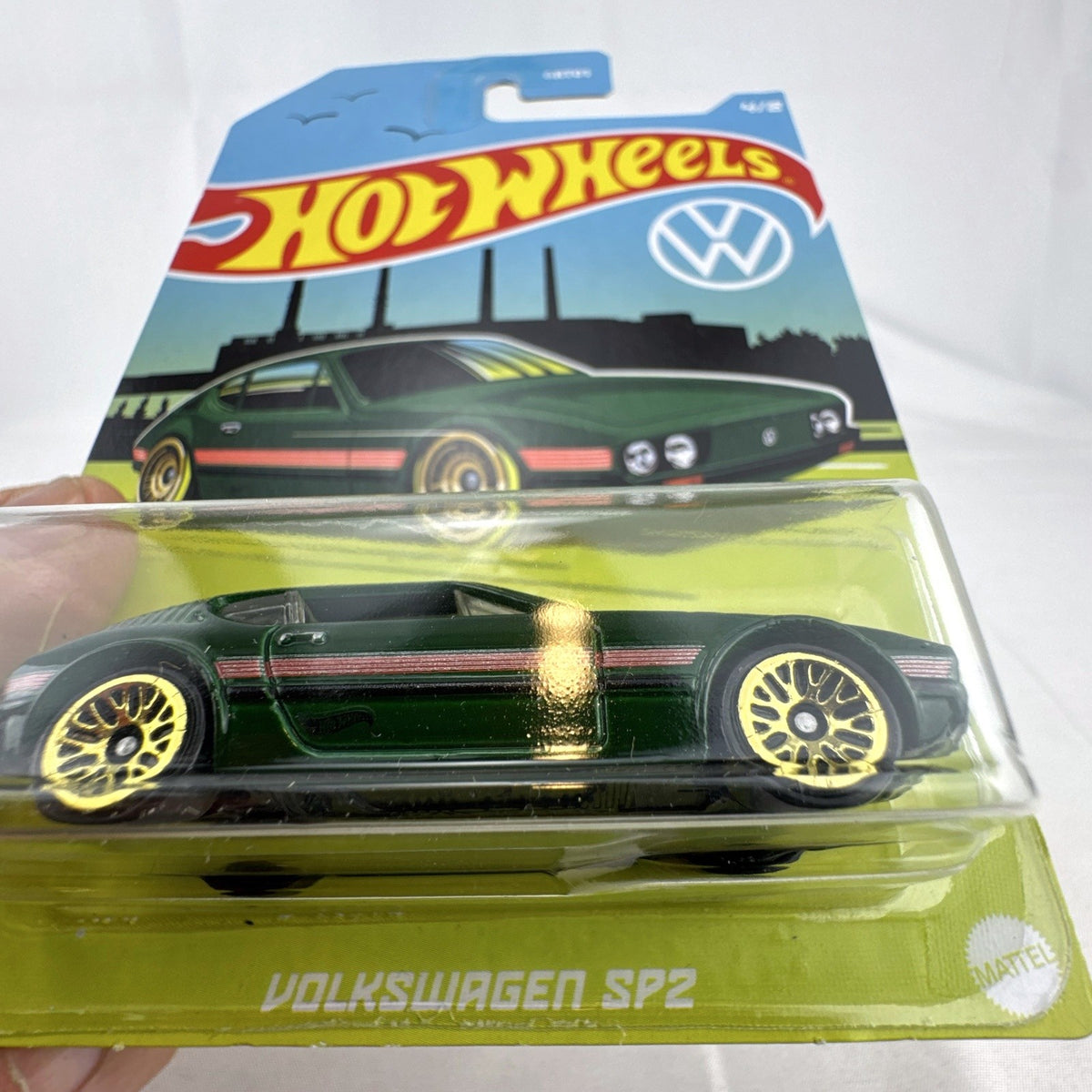 Hot Wheels 1:64 scale Volkswagen SP2 diecast car in green with gold wheels sealed on original packaging card