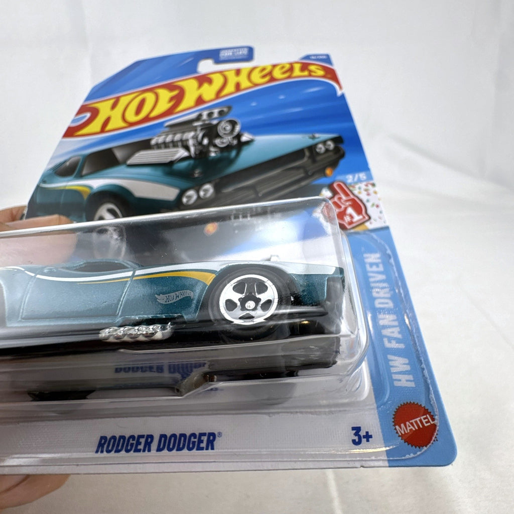 Hot Wheels Rodger Dodger 1:64 scale diecast muscle car in dark metallic teal, unopened on original card packaging.