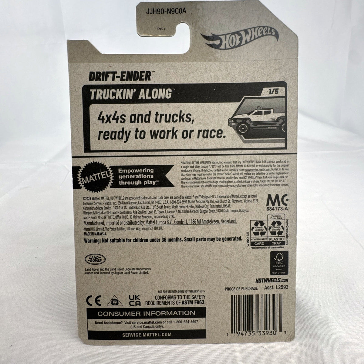 Hot Wheels 1:64 scale Drift-Ender Land Rover Defender diecast truck in dark red and gold, factory sealed on card.