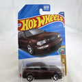 Hot Wheels 1994 Audi Avant RS2 1:64 diecast wagon in dark metallic brown sealed on original card